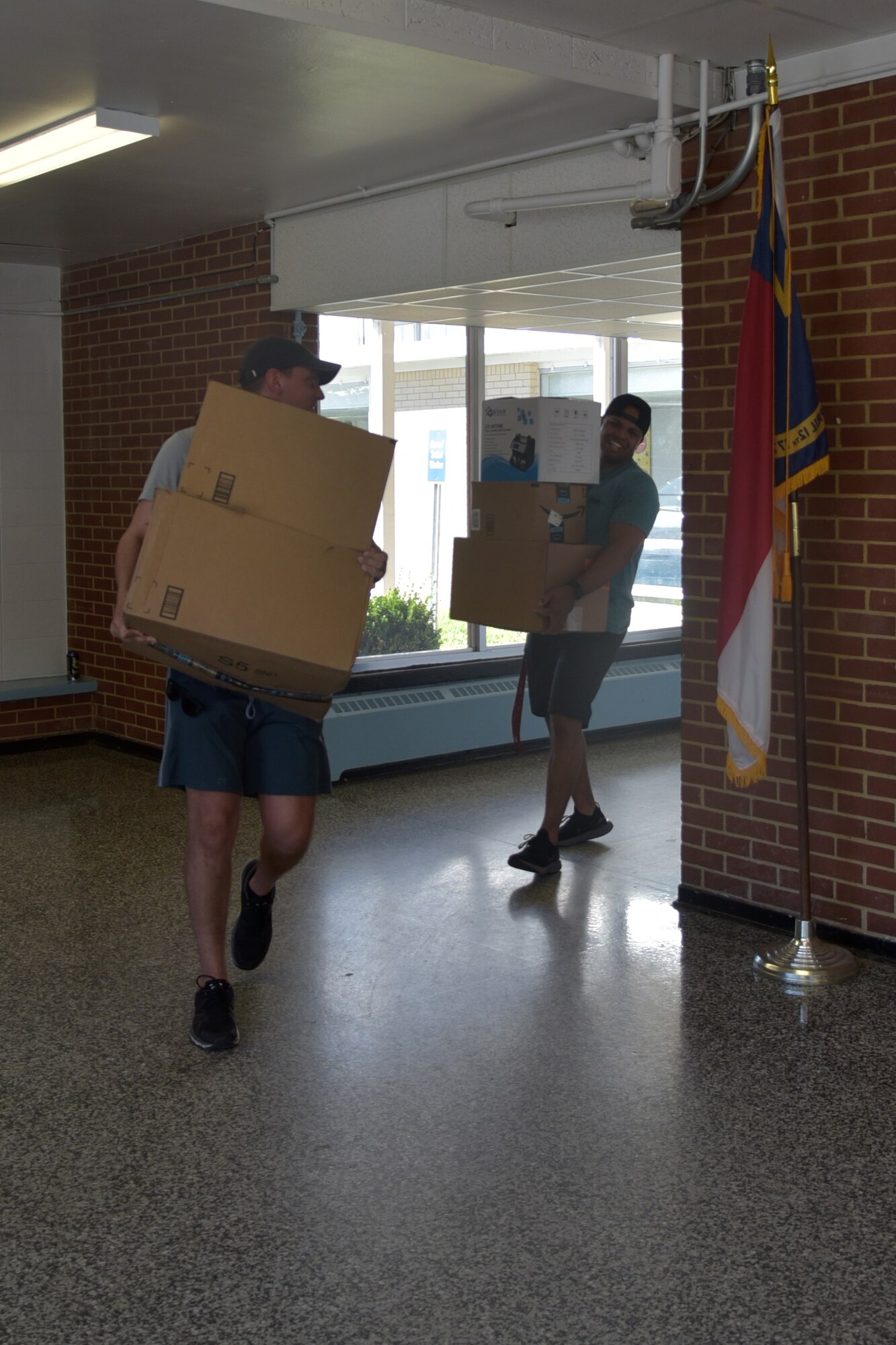 Airmen assigned to Seymour Johnson Air Force Base assist with moving equipment from the old Meadow Lane Elementary School into the newly constructed facility June 14, 2019, in Goldsboro, North Carolina.