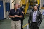 190529-N-LT766-0004 PHILADELPHIA (May 29, 2019) Andy Carirns, left, leads Steven Lagana, right, NAVSEA PMS 555 Shipyard Infrastructure Optimization Program (SIOP) on a tour of the Naval Surface Warfare Center Philadelphia Division (NSWCPD) campus. During the visit Lagana saw many test sites and labs including the Advanced Data Acquisition, Prototype Technology and Virtual Environments (ADAPTVE) lab. (U.S. Navy Photo by Mass Communication Specialist 1st Class John Banfield/Released) (This photo has been altered for security purposes by blurring out identification badges.)