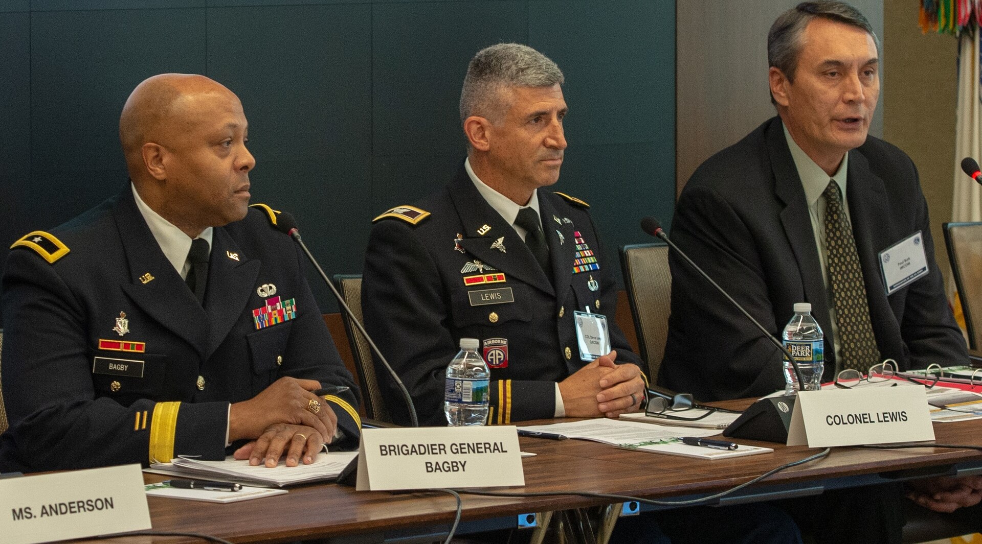 Col. Steve Lewis (center), chief of family programs for the Office of the Assistant Chief of Staff for Installation Management, participates in a panel discussion along with Brig. Gen. Shan K. Bagby, deputy chief of staff for support at the Office of the Surgeon General, and Paul D. Burk, director of G-9 for Army Installation Command, at the Association of the U.S. Army headquarters in Arlington, Virginia June 12. Lewis spoke of the Army Emergency Relief's new program to reimburse spouses up to $2,500 for relicensing expenses.