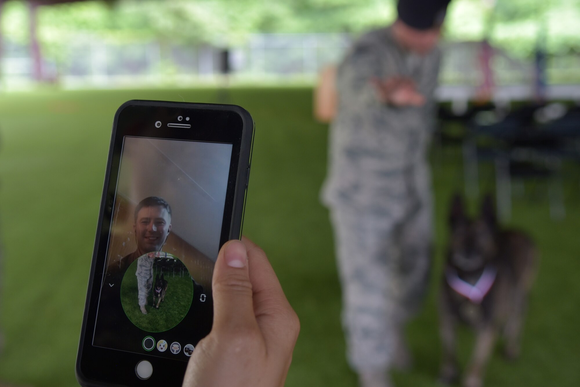 Staff Sgt. Nicholas Armstrong, 4th Security Forces Squadron Military Working Dog handler, watches MWD Ronni P835’s retirement ceremony via video chat, June 11, 2019, at Seymour Johnson Air Force Base, North Carolina.