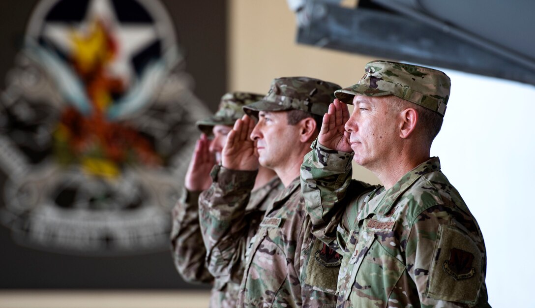 Wing leadership salutes during the playing of the National Anthem during a change of command ceremony, June 17, 2019, at Moody Air Force Base, Ga. The ceremony is a military tradition that represents a formal transfer of a unit’s authority and responsibility from one commander to another. (U.S. Air Force photo by Senior Airman Erick Requadt)