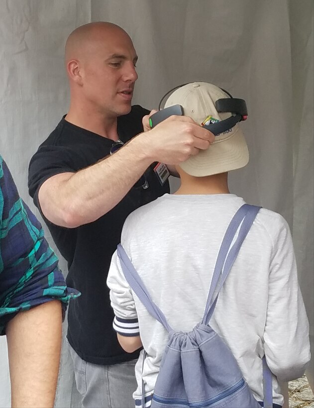 Philadelphia (May 4, 2019) NSWCPD’s Patrick Violante, demonstrates technology from the ADAPT.VE Lab during the Philadelphia Science Carnival on May 4. The Philadelphia Science Carnival is just one of the ways NSWCPD engages with the Greater Philadelphia Area and interests the next generation of Navy engineers in a STEM career. (U.S. Navy Photo by Margaret Kenyon)/Released