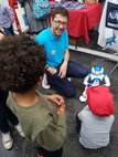 PHILADELPHIA (May 4, 2019) NSWCPD’s STEM Outreach Coordinator Tristan Wolfe demonstrates programming concepts using “William” the robot during the Philadelphia Science Carnival on May 4. Other STEM-related technologies highlighted by NSWCPD engineers included laser metrology and cybersecurity. (U.S. Navy photo by Margaret Kenyon)/Released