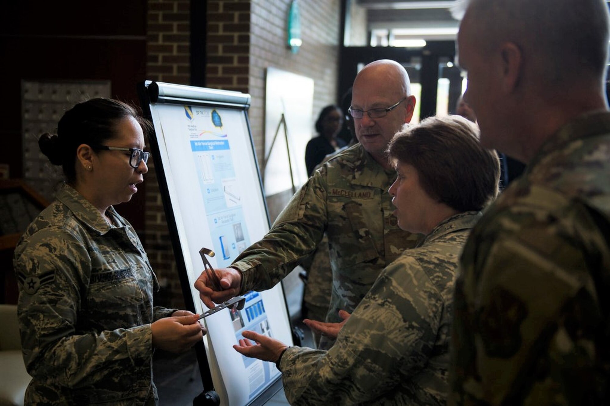Airman 1st Class Jocelyn Raymundo-Grinstead, 11th Medical Surgical Squadron surgical technician, describes the features of the Air Force surgical retractor tool that she designed during the first AFDW Innovation Summit at Joint Base Andrews, Md., June 12, 2019. (U.S. Air Force photo by Master Sgt. Michael B. Keller)