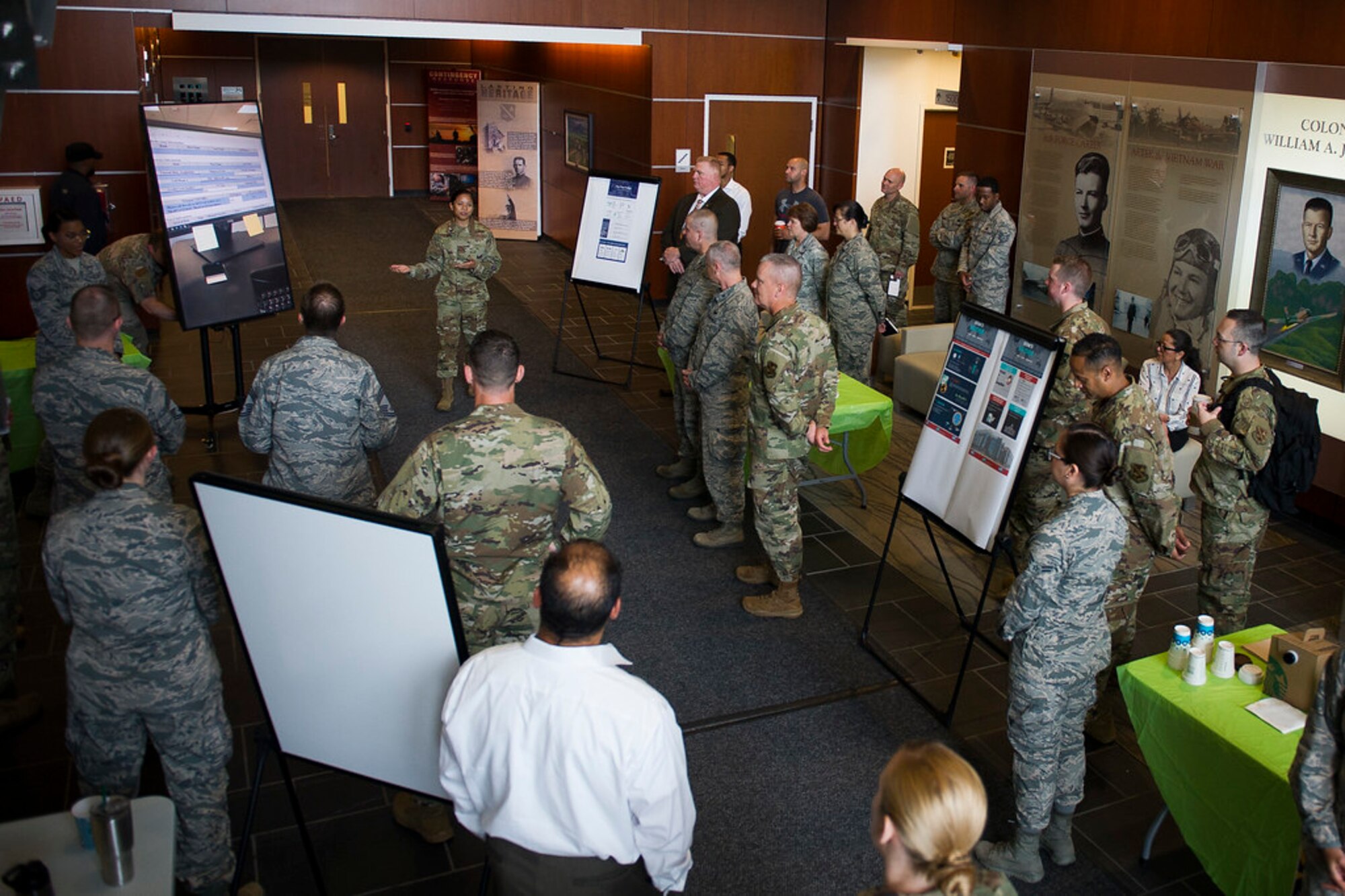Capt. Charito Corvin, 844th Communications Group operation officer, gives opening remarks in the Jones Building during the first AFDW Innovation Summit at Joint Base Andrews, Md., June 12, 2019. (U.S. Air Force photo by Master Sgt. Michael B. Keller)