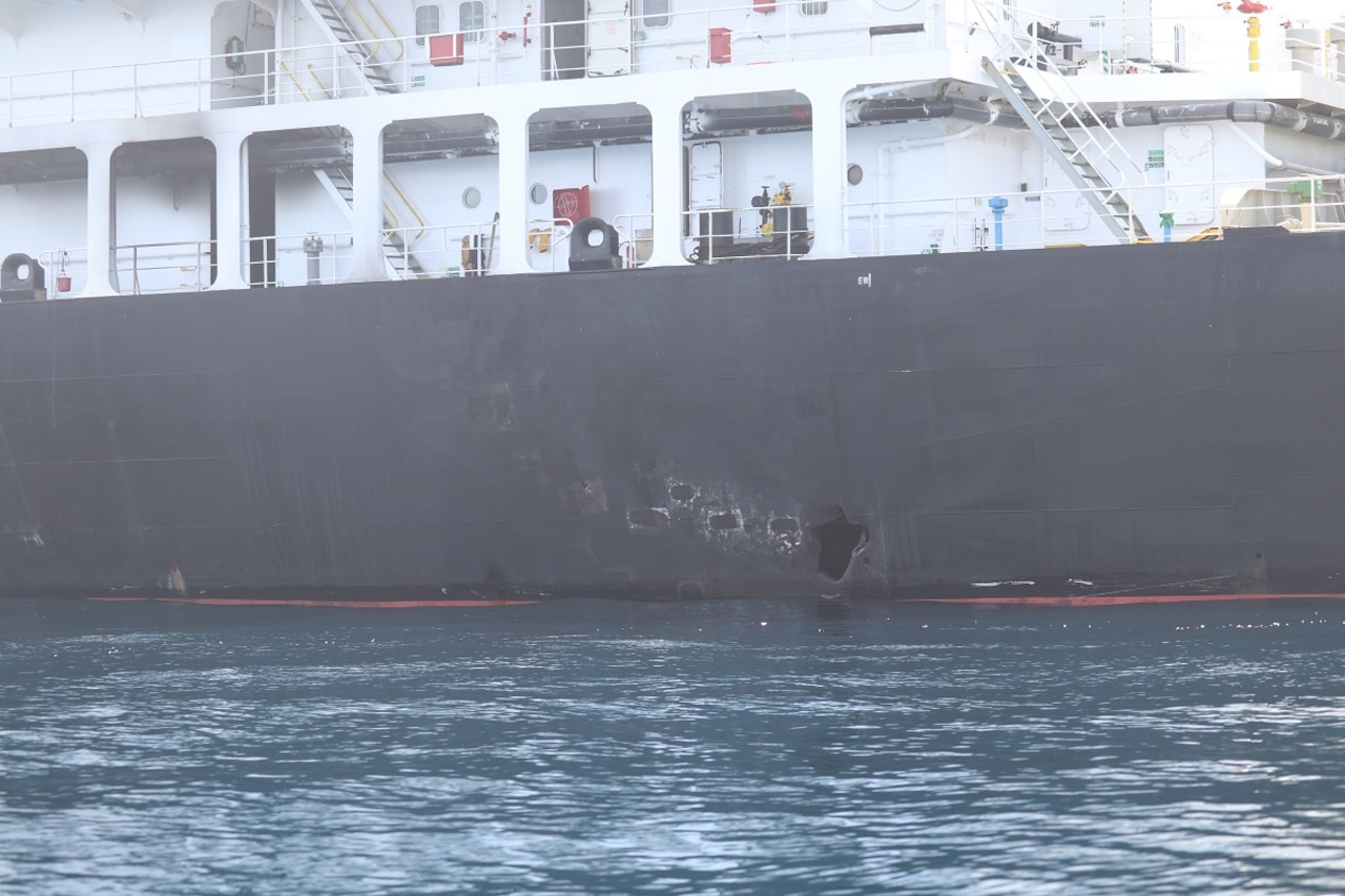 Hole in side of oil tanker.