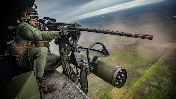 U.S. Marine Corps Sgt. Darrin Smith, a crew chief with Marine Light Attack Helicopter Squadron 775, Marine Aircraft Group 41, 4th Marine Aircraft Wing, operates a GAU-21/A during a live-fire event at Cold Lake Air Weapons Range, Alberta, Canada, June 15, 2019, in support of Sentinel Edge 19. The Marine Reserve plays a critical component to the Marine Corps’ Total Force, and training such as SE19 helps ensure Reserve units combat effectiveness and proficiency for world-wide deployment.
