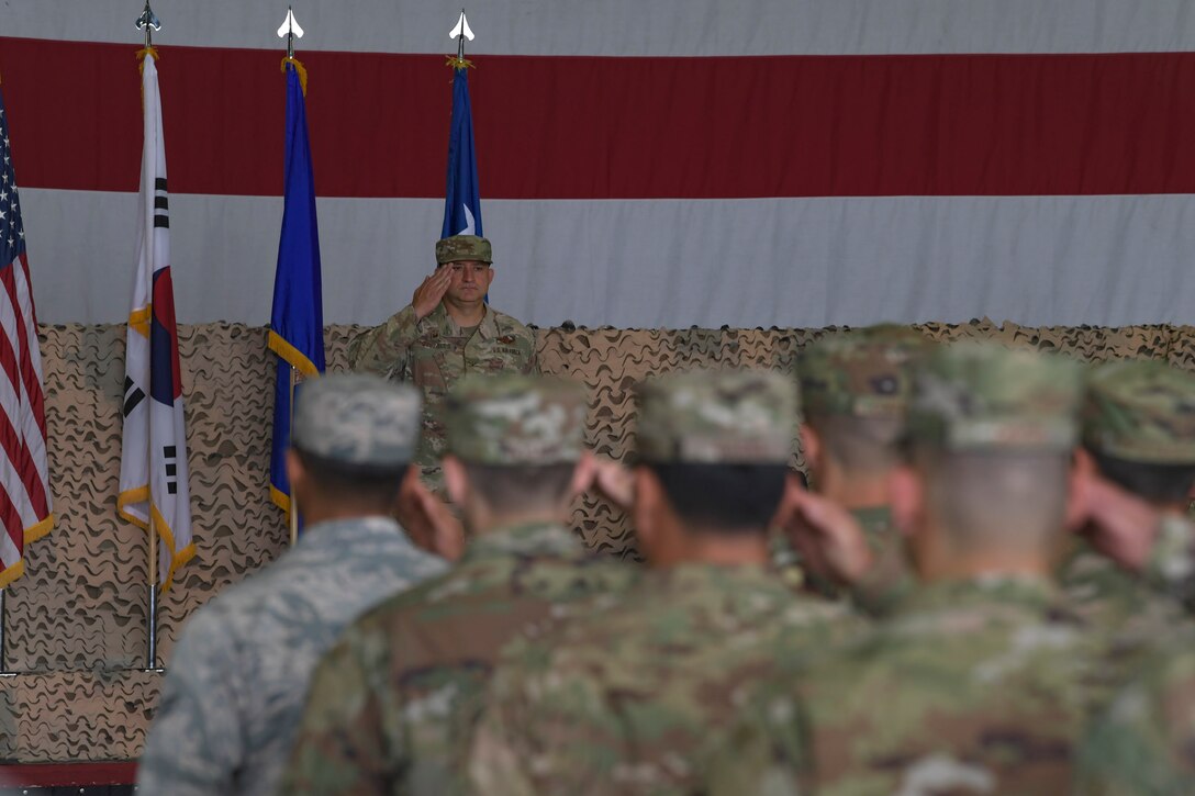 U.S. Air Force Col. John Gonzales, 51st Fighter Wing commander, renders his first salute to his wing during a change of command ceremony, June 18, 2019, at Osan Air Base, Republic of Korea. Gonzales, a prior 25th Fighter Squadron A-10C Thunderbolt II pilot, will again carry the Mustang tradition. Now, he leads the most forward deployed wing in the world, providing combat ready forces in support of the ROK. (U.S. Air Force photo by Staff Sgt. Greg Nash)