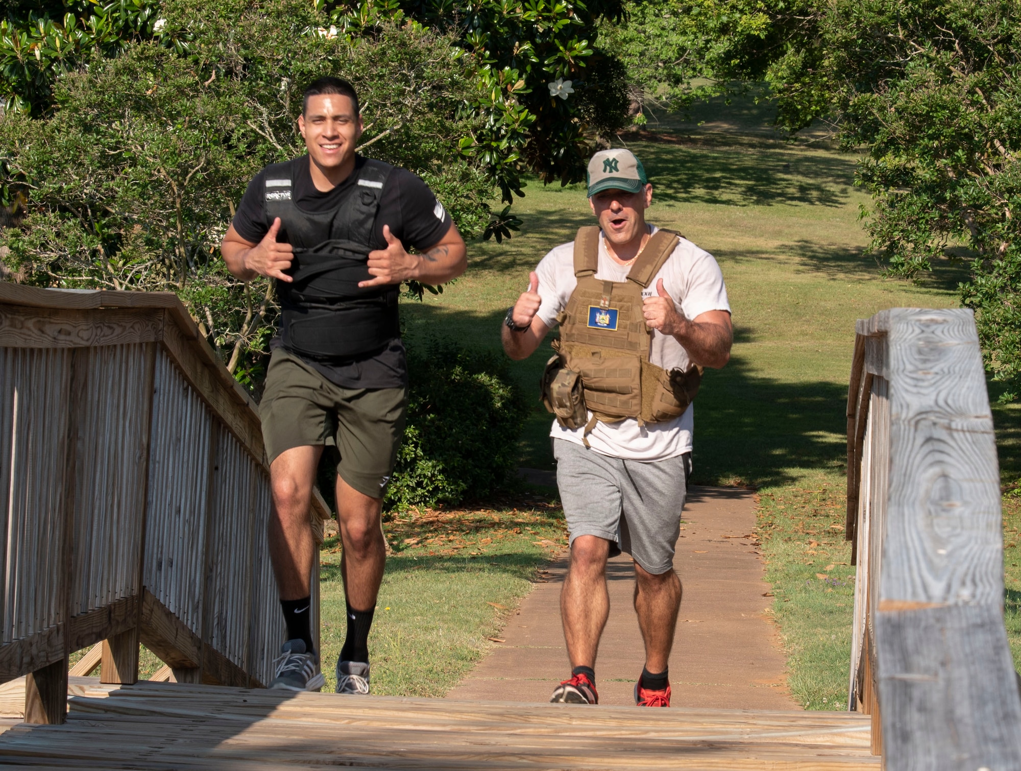 U.S. U.S. Staff Sgt. Carlos Wooten, 20th Fighter Wing (FW) religious affairs Airman, left, and Maj. Nicholas Lopresto, 20th Fighter Wing chaplain, participate in a “Murph challenge” complete their second 1-mile run at Memorial Lake, Shaw Air Force Base, South Carolina, May 28, 2019.