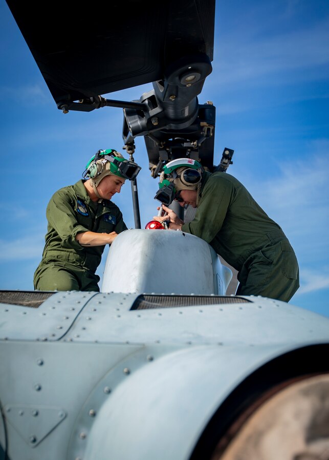 U.S. Marines with Marine Light Attack Helicopter Squadron 775, Marine Aircraft Group 41, 4th Marine Aircraft Wing, conduct a maintenance check at Canadian Forces Base Cold Lake, Canada, June 16, 2019, in support of Sentinel Edge 19. Training exercises, such as SE19, ensures Reserve Marines are proficient and capable of successful integration with active-duty Marines, making Marine Forces Reserve critical to the Marine Corps’ Total Force. (U.S. Marine Corps photo by Lance Cpl. Jose Gonzalez)