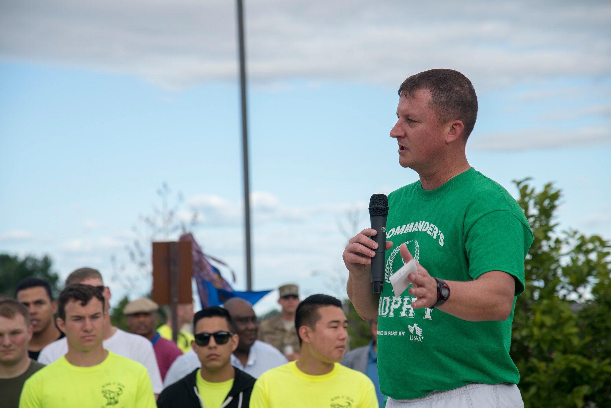 Col. Jones speaks to a crowd of Airmen who have gathered for Sports Day June 14, 2019 at Dover Air Force Base, Del. Jones gave the opening remarks after a quick mile warmup run to begin this year’s Sports Day, which is the first since 2008. (U.S. Air Force photo by A1C Jonathan Harding)