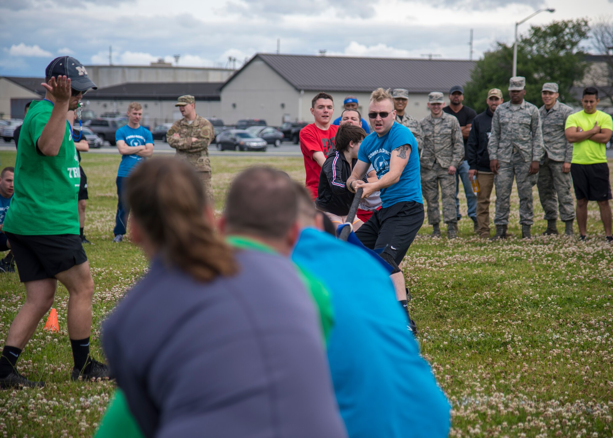 The referee signals the end of the round, declaring a winner June 14, 2019 at Dover Air Force Base, Del. The tug-of-war event had eleven teams battling for the number one slot in the competition, which was taken by the 436th Logistics Readiness Squadron. (U.S. Air Force photo by A1C Jonathan Harding)