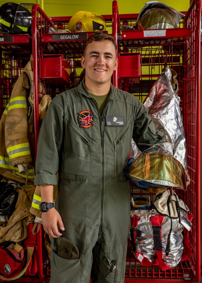 U.S. Marine Corps Lance Cpl. Michael Hubener, an aircraft rescue and firefighting specialist with Marine Wing Support Squadron 471, Marine Aircraft Group 41, 4th Marine Aircraft Wing, poses for a photo after a physical training test at Canadian Forces Base Cold Lake, Canada, June 14, 2019, in support of Sentinel Edge 19. Each portion of the test simulated tasks that every Reserve Marine with Aircraft Rescue and Firefighting would be expected to complete in a timely manner if an accident were to occur in an airfield. Reserve Marines with MAG-41 conducted the test to maintain job proficiency and ensure deployment readiness. (U.S. Marine Corps photo by Lance Cpl. Jose Gonzalez)