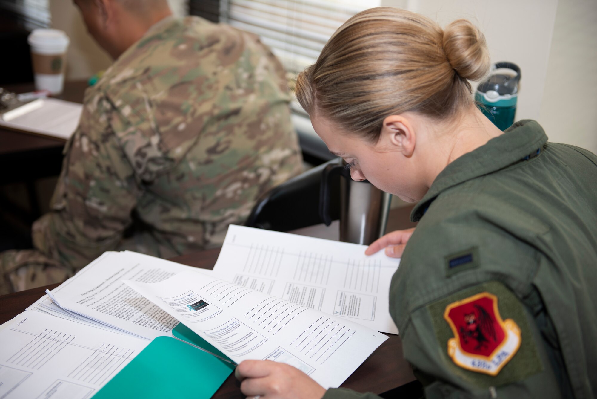 U.S. Air Force 1st Lt. Shannon, 50th Attack Squadron MQ-9 pilot, reads about ways to defend one’s self from an attacker during a sexual assault preventative response class at Shaw Air Force Base, South Carolina, June 12, 2019.