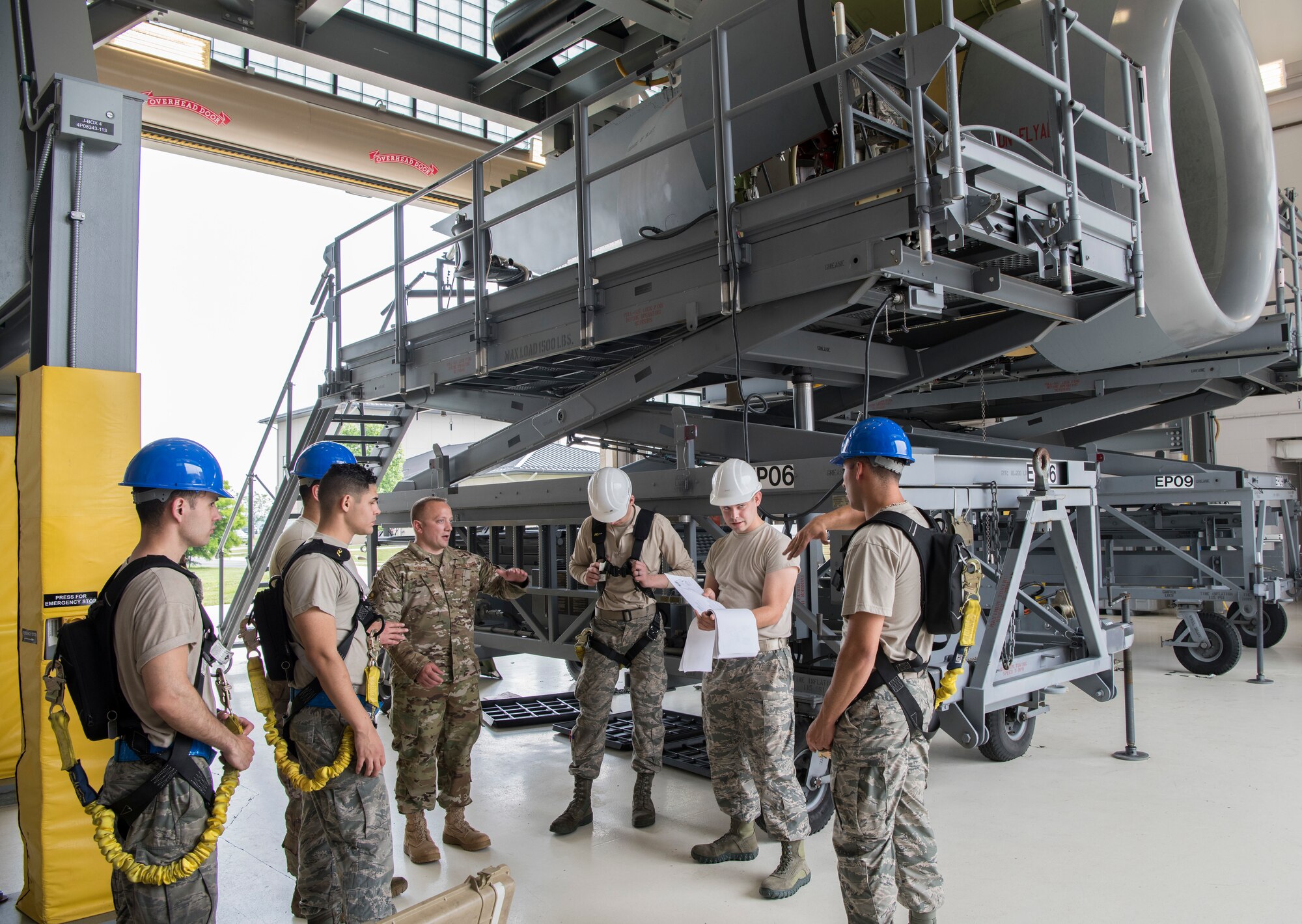 Tech. Sgt. Robert Enrico, 373rd Training Squadron field training detachment instructor, Detachment 3, gives helpful instructions to the Airmen attending the C-5M Super Galaxy engine-changing course June 6, 2019, Dover Air Force Base, Del. Enrico only provided advice when it was needed, which allowed the Airmen to work together as a team and apply the knowledge they obtained throughout the course. (U.S. Air Force photo by Senior Airman Christopher Quail)