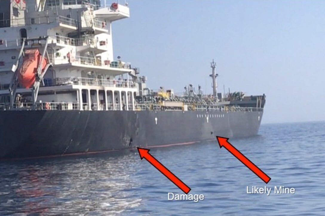 Explosion damage and likely limpet mine on a ship's hull