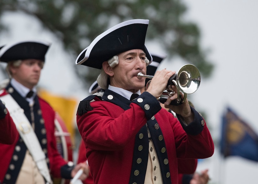 A member of the U.S. Army Old Guard Fife and Drum Corps plays the trumpet during the “Music Under the Stars” concert series at Joint Base Langley-Eustis, Virginia, June 13, 2019.