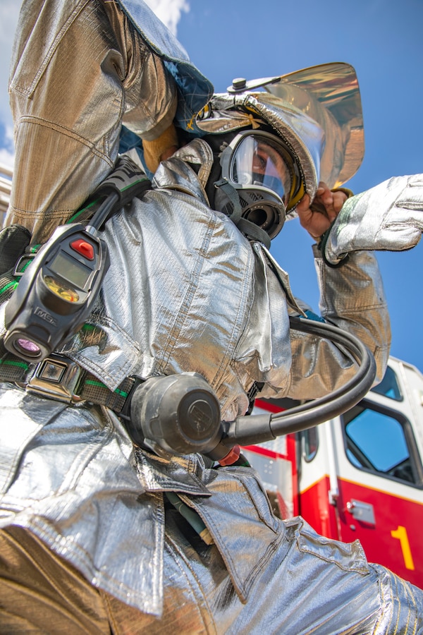 A U.S. Marine aircraft rescue and firefighting specialist with Marine Wing Support Squadron 471, Marine Aircraft Group 41, 4th Marine Aircraft Wing, puts on protective gear during combined firefighting training at Canadian Forces Base Cold Lake, Canada, June 16, 2019, in support of Sentinel Edge 19. The Marine Reserve plays a critical component to the Marine Corps’ Total Force, and training such as SE19 helps ensure Reserve units combat effectiveness and proficiency for world-wide deployment. (U.S. Marine Corps photo by Sgt. Andy O. Martinez)