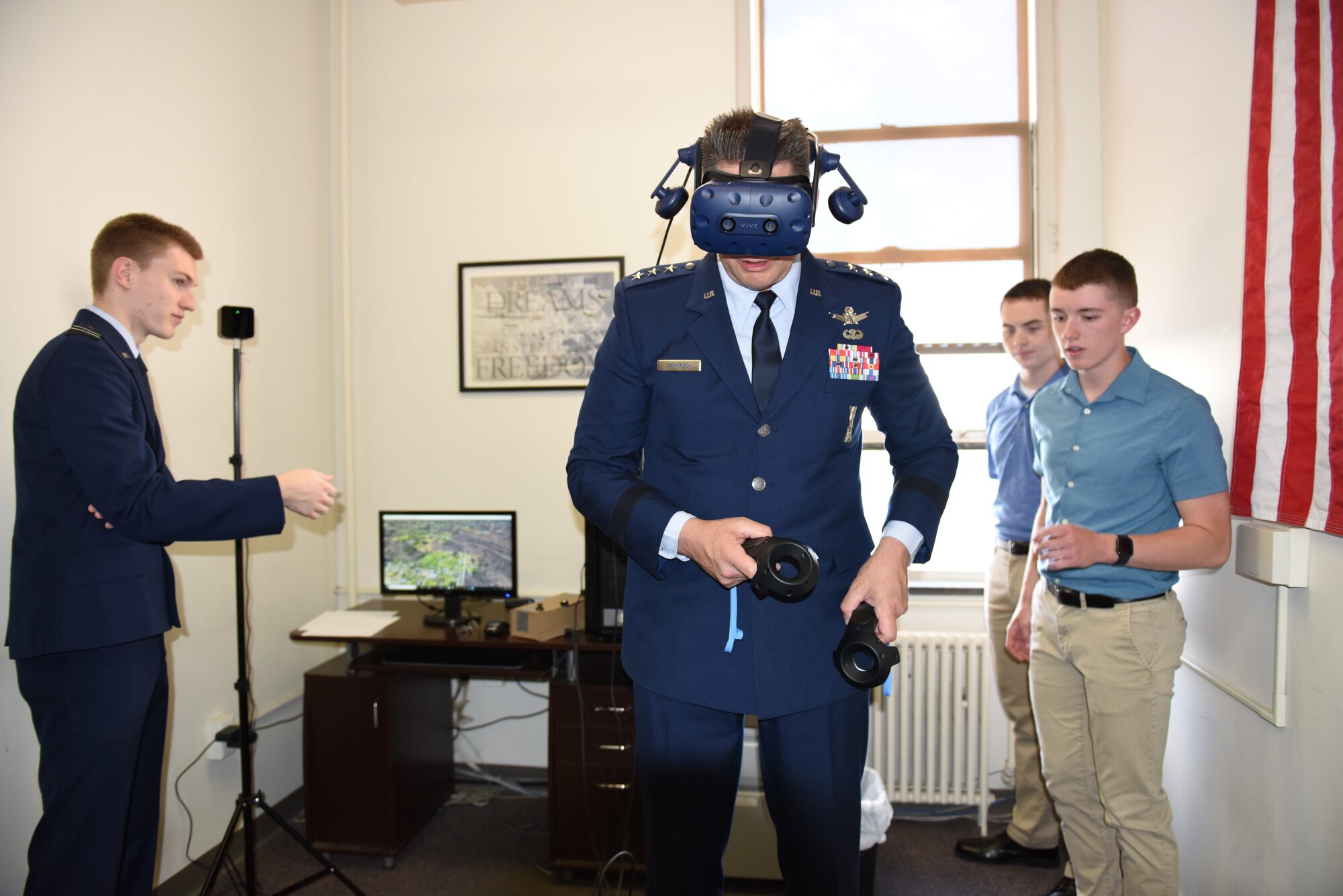 Lt. Gen. David Thompson, Air Force Space Command vice commander, uses virtual reality goggles with the assistance of cadets from Air Force ROTC Detachment 730 in Pittsburgh, Pennsylvania June 14, 2019.