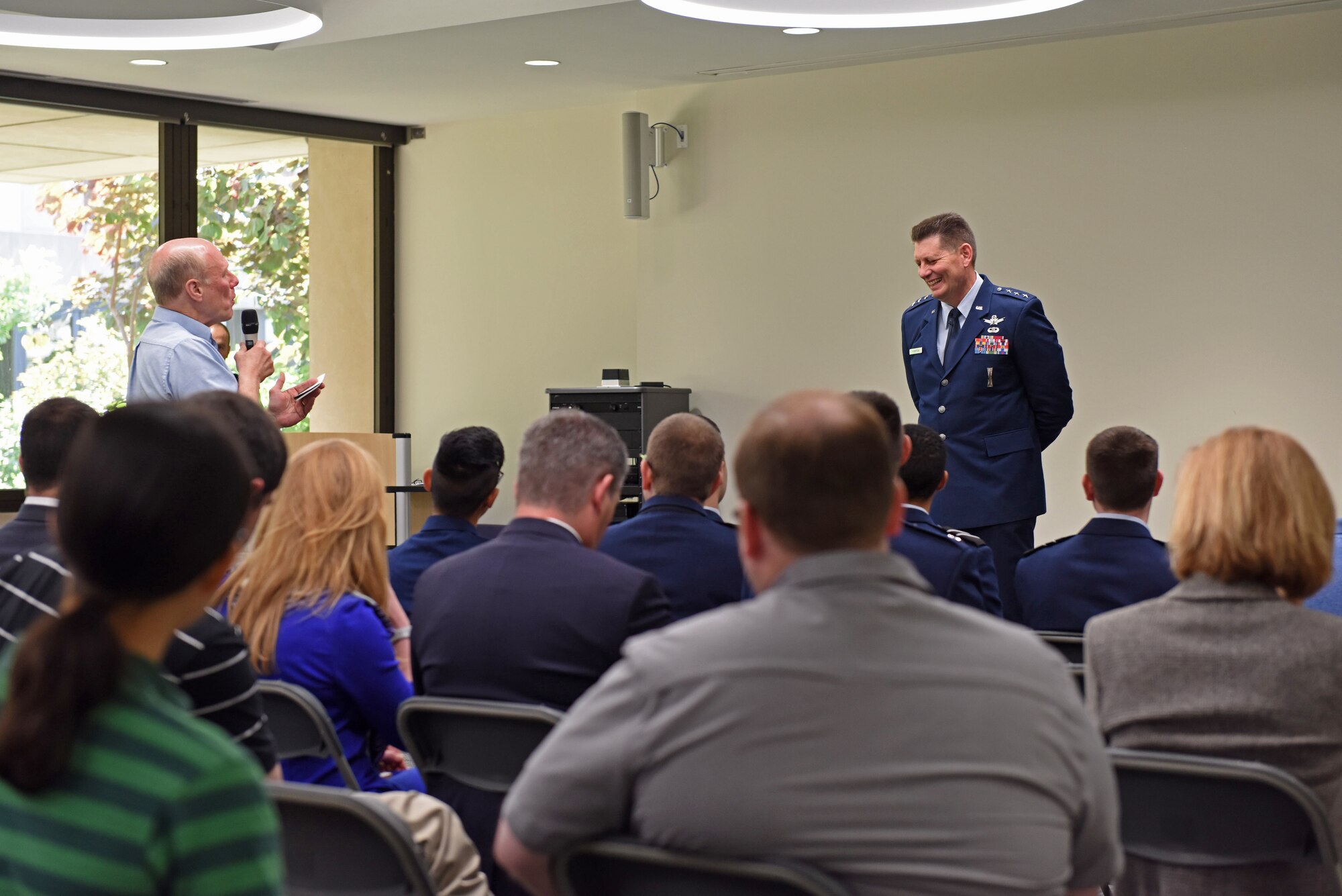 Lt. Gen. David Thompson, Air Force Space Command vice commander, laughs at a joke told by a University of Pittsburgh professor during a Q&A session in Pittsburgh, Pennsylvania June 14, 2019.
