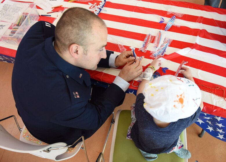 Capt. Justin Lewis, public affairs officer assigned to Secretary of the Air Force Public Affairs, interacts with a patient at Children’s Hospital of Pittsburgh, June 14, 2019.