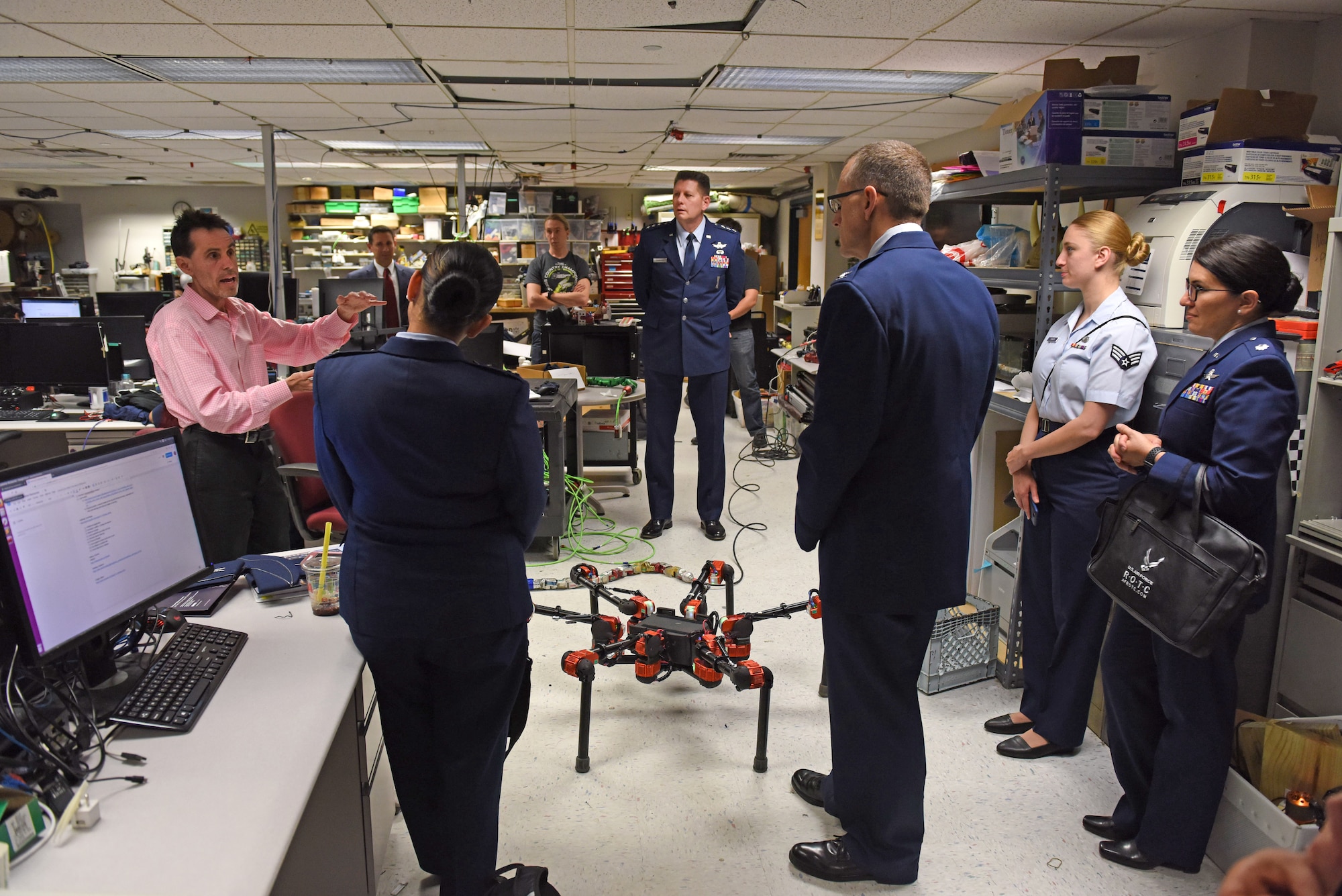 A robotics professor with Carnegie Mellon University briefs Lt. Gen. David Thompson, Air Force Space Command vice commander, and other Air Force members on developments in robotics in Pittsburgh, June 14, 2019.