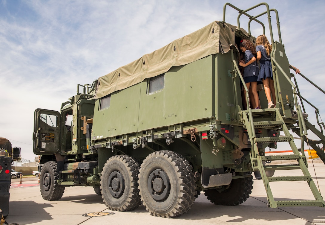 Students from Yuma Lutheran School and Desert Sonora Elementary School visit Marine Corps Air Station (MCAS) Yuma, Ariz., May 9, 2019. The students observed a demonstration of a military working dog, Marine Corps Martial Arts Program (MCMAP) techniques, and the Marine Corps Obstacle Course. They were also able to see various static displays ranging from a Search and Rescue (SAR) helicopter to a AV-8B Harrier. (U.S. Marine Corps photo by Cpl. Sabrina Candiaflores)