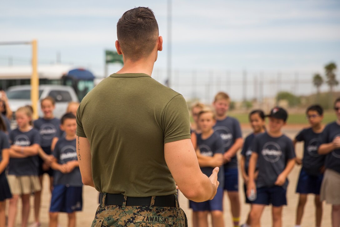 Students from Yuma Lutheran School and Desert Sonora Elementary School visit Marine Corps Air Station (MCAS) Yuma, Ariz., May 9, 2019. The students observed a demonstration of a military working dog, Marine Corps Martial Arts Program (MCMAP) techniques, and the Marine Corps Obstacle Course. They were also able to see various static displays ranging from a Search and Rescue (SAR) helicopter to a AV-8B Harrier. (U.S. Marine Corps photo by Cpl. Sabrina Candiaflores)