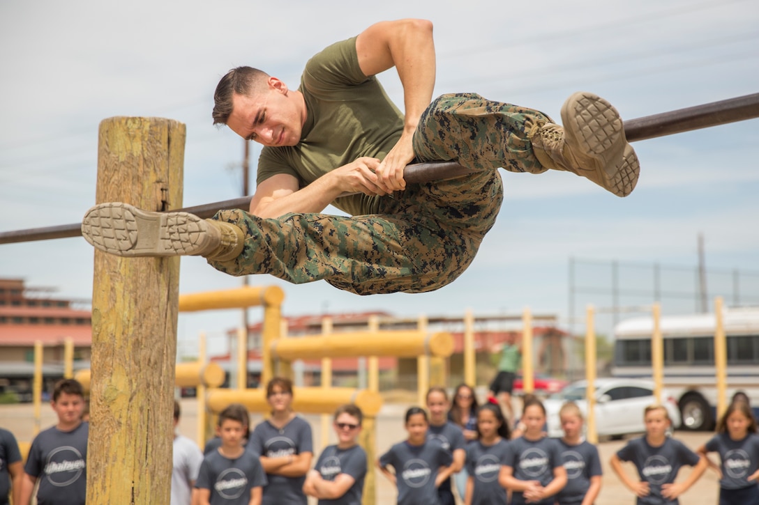 Students from Yuma Lutheran School and Desert Sonora Elementary School visit Marine Corps Air Station (MCAS) Yuma, Ariz., May 9, 2019. The students observed a demonstration of a military working dog, Marine Corps Martial Arts Program (MCMAP) techniques, and the Marine Corps Obstacle Course. They were also able to see various static displays ranging from a Search and Rescue (SAR) helicopter to a AV-8B Harrier. (U.S. Marine Corps photo by Cpl. Sabrina Candiaflores)
