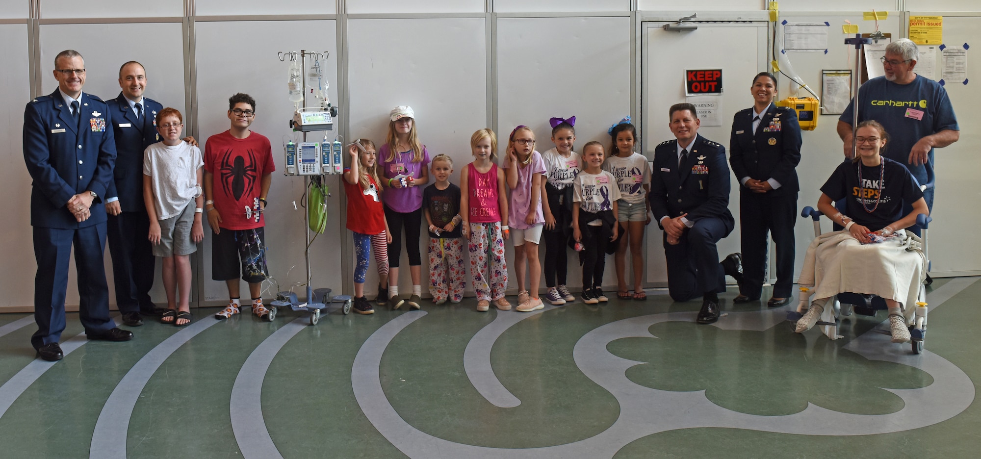 911th Operations Group Commander Col. Gregory Buchanan, Public Affairs Officer Capt. Justin Lewis, Air Force Space Command Vice Commander Lt. Gen. David Thompson, and Executive Assistant Capt. Marcianna Pease pose for a photo with patients and their families at Children’s Hospital of Pittsburgh, June 14, 2019.