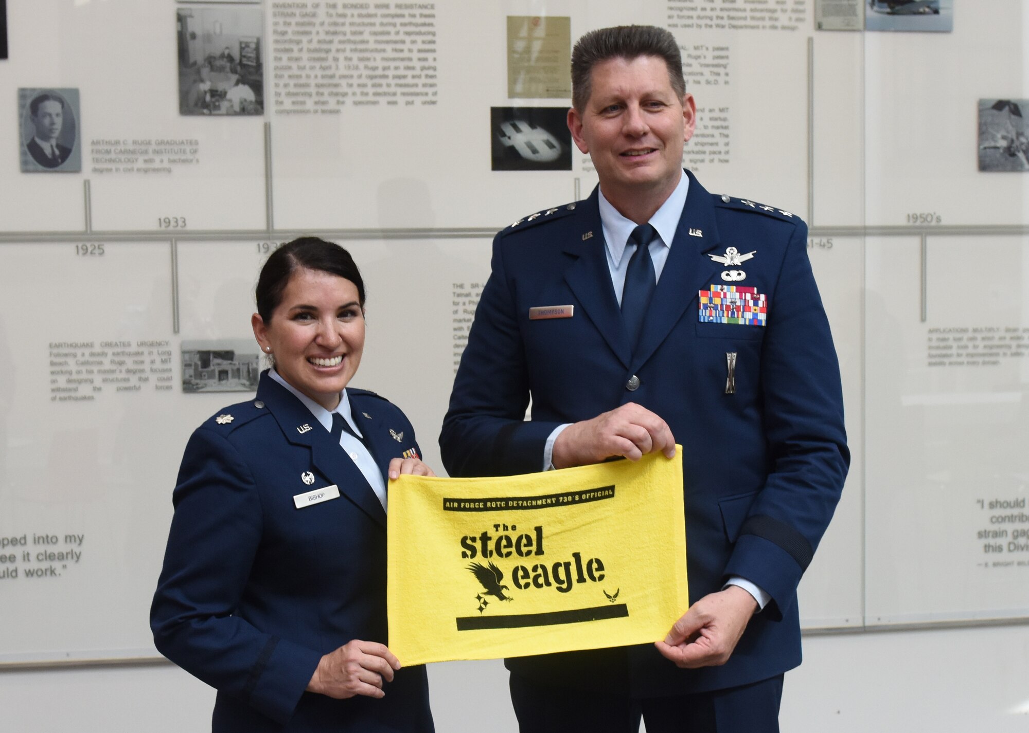Lt. Col. Diana Bishop, commander of Air Force ROTC Detachment 730, presents a gift to Air Force Space Command Vice Commander Lt. Gen. David Thompson in Pittsburgh, June 14, 2019.