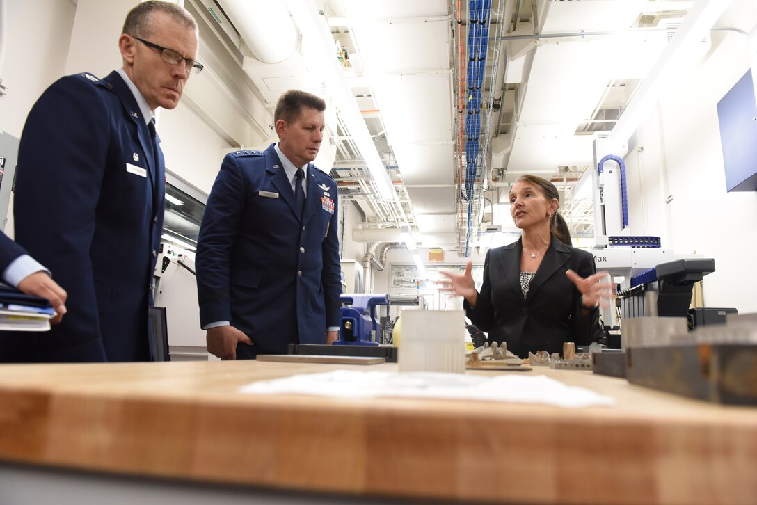 911th Operations Group Commander Col. Gregory Buchanan and Air Force Space Command Vice Commander Lt. Gen. David Thompson learn about the benefits of metal additives manufacturing at Carnegie Mellon University in Pittsburgh, Pennsylvania, June 14, 2019.