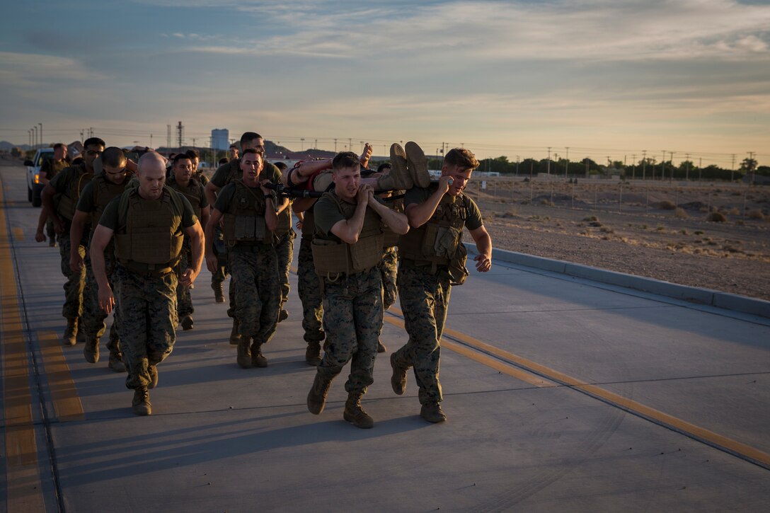 U.S. Marines stationed at Marine Corps Air Station (MCAS) Yuma conduct a Casualty Evacuation run as part of their physical training during Corporals Course at MCAS Yuma, Ariz., May 15, 2019. Corporals Course is a leadership class designed to teach Marines the fundamentals of being a noncomissioned officer. (U.S. Marine Corps photo by Pfc. John Hall)