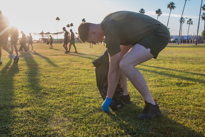 U.S. Marines with Headquarters & Headquarters Squadron (H&HS) conduct a base wide clean up at Marine Corps Air Station (MCAS) Yuma, Ariz., May 15, 2019. The base clean up is intended to boost unit morale and ensure the cleanliness of MCAS Yuma. (U.S. Marine Corps photo by Cpl. Sabrina Candiaflores)