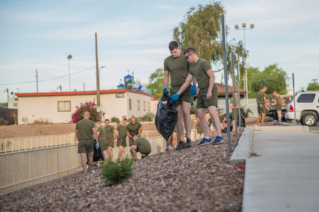 U.S. Marines with Headquarters & Headquarters Squadron (H&HS) conduct a base wide clean up at Marine Corps Air Station (MCAS) Yuma, Ariz., May 15, 2019. The base clean up is intended to boost unit morale and ensure the cleanliness of MCAS Yuma. (U.S. Marine Corps photo by Cpl. Sabrina Candiaflores)