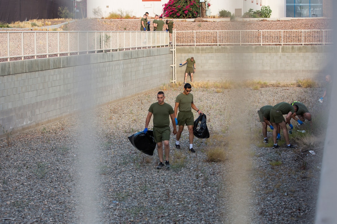 U.S. Marines with Headquarters & Headquarters Squadron (H&HS) conduct a base wide clean up at Marine Corps Air Station (MCAS) Yuma, Ariz., May 15, 2019. The base clean up is intended to boost unit morale and ensure the cleanliness of MCAS Yuma. (U.S. Marine Corps photo by Cpl. Sabrina Candiaflores)