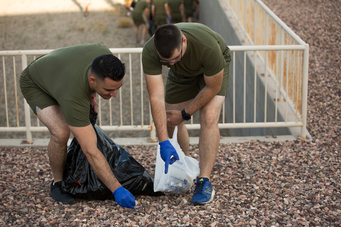 U.S. Marines with Headquarters & Headquarters Squadron (H&HS) conduct a base wide clean up at Marine Corps Air Station (MCAS) Yuma, Ariz., May 15, 2019. The base clean up is intended to boost unit morale and ensure the cleanliness of MCAS Yuma. (U.S. Marine Corps photo by Cpl. Sabrina Candiaflores)
