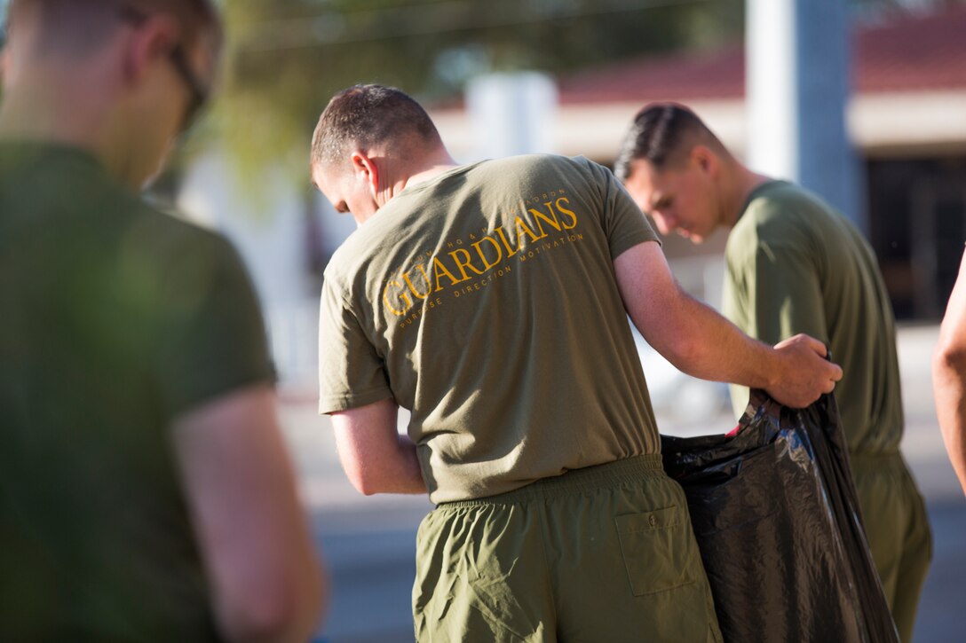 U.S. Marines with Headquarters & Headquarters Squadron (H&HS) conduct a base wide clean up at Marine Corps Air Station (MCAS) Yuma, Ariz., May 15, 2019. The base clean up is intended to boost unit morale and ensure the cleanliness of MCAS Yuma. (U.S. Marine Corps photo by Cpl. Sabrina Candiaflores)