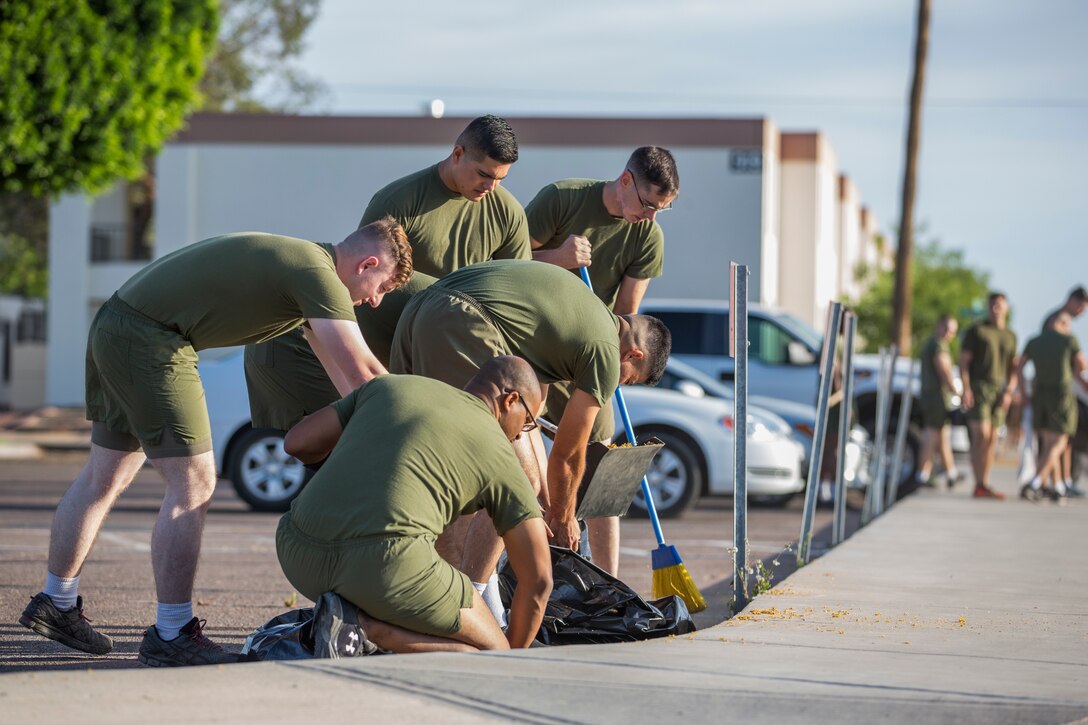 U.S. Marines with Headquarters & Headquarters Squadron (H&HS) conduct a base wide clean up at Marine Corps Air Station (MCAS) Yuma, Ariz., May 15, 2019. The base clean up is intended to boost unit morale and ensure the cleanliness of MCAS Yuma. (U.S. Marine Corps photo by Cpl. Sabrina Candiaflores)
