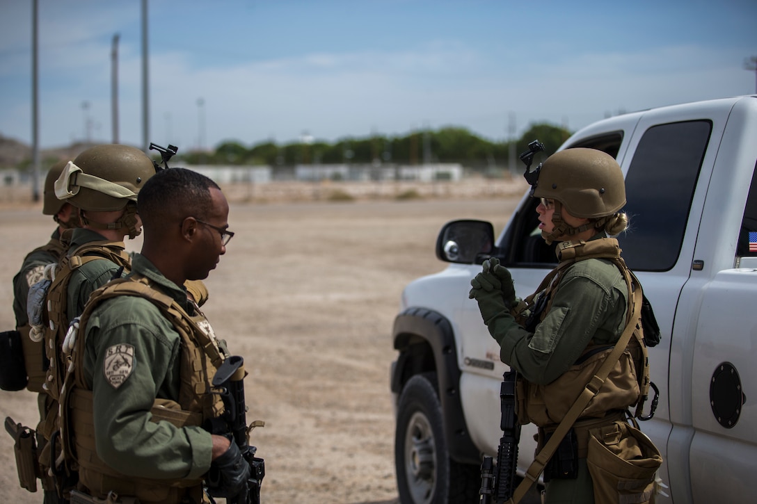 U.S. Marines with the Provost Marshal's Office, Headquarters and Headquarters Squadron, Marine Corps Air Station (MCAS) Yuma, conduct Special Reaction Team (SRT) vehicle assault training on MCAS Yuma, Ariz., May 16, 2019. The SRT is comprised of military police personnel trained to give an installation commander the ability to counter or contain a special threat situation surpassing normal law enforcement capabilities. (U.S. Marine Corps photo by Pfc. John Hall)