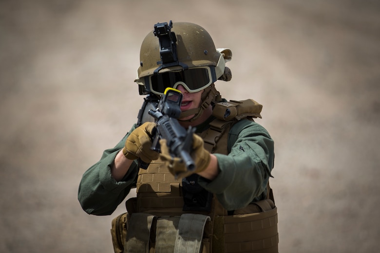 U.S. Marines with the Provost Marshal's Office, Headquarters and Headquarters Squadron, Marine Corps Air Station (MCAS) Yuma, conduct Special Reaction Team (SRT) vehicle assault training on MCAS Yuma, Ariz., May 16, 2019. The SRT is comprised of military police personnel trained to give an installation commander the ability to counter or contain a special threat situation surpassing normal law enforcement capabilities. (U.S. Marine Corps photo by Pfc. John Hall)