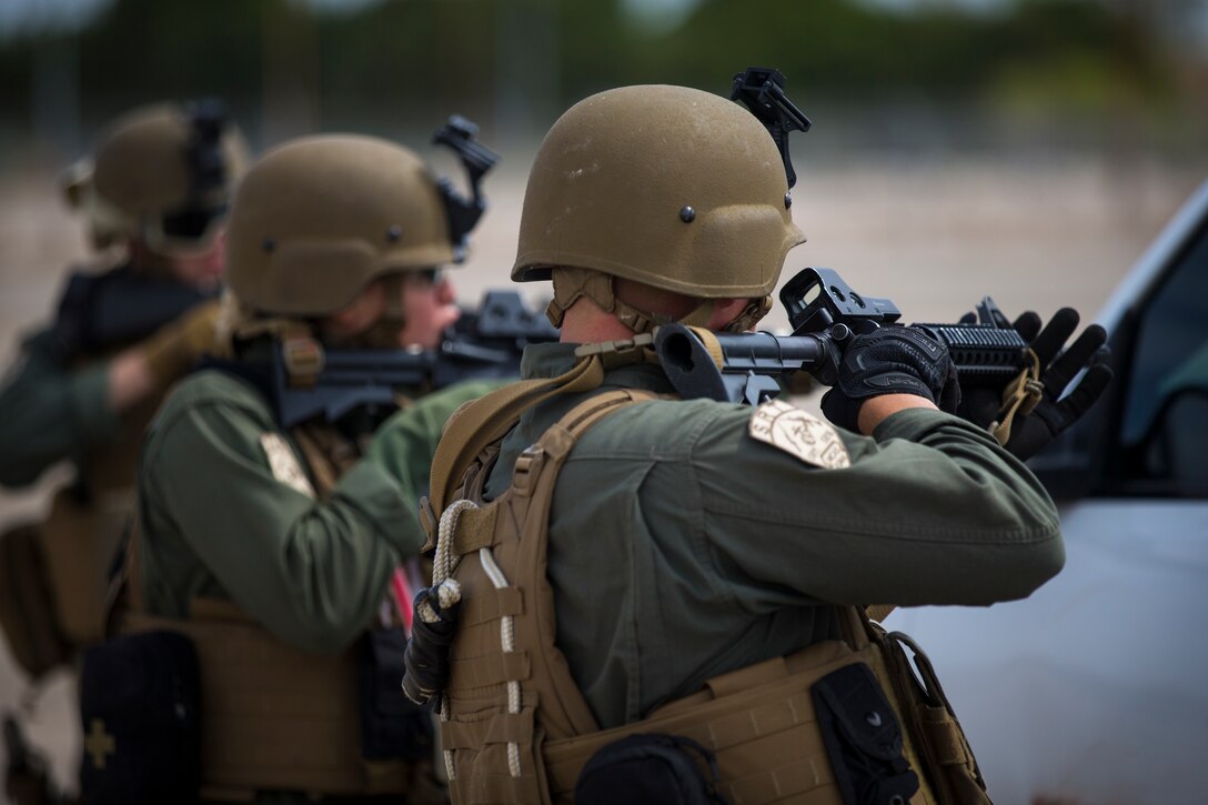 U.S. Marines with the Provost Marshal's Office, Headquarters and Headquarters Squadron, Marine Corps Air Station (MCAS) Yuma, conduct Special Reaction Team (SRT) vehicle assault training on MCAS Yuma, Ariz., May 16, 2019. The SRT is comprised of military police personnel trained to give an installation commander the ability to counter or contain a special threat situation surpassing normal law enforcement capabilities. (U.S. Marine Corps photo by Pfc. John Hall)