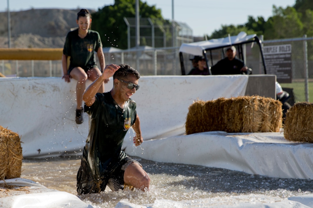 U.S. Marines, Sailors, and Civilians participate in the Marine Corps Air Station (MCAS) Yuma Mud Run at MCAS Yuma Ariz., May 18, 2019. The Mud Run consisted of various obstacles for all of the participants in both the competitive and non-competitive events. (U.S. Marine Corps photo by Lance Cpl. Joel Soriano)