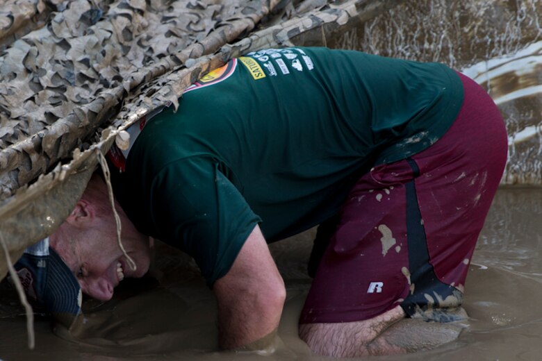 U.S. Marines, Sailors, and Civilians participate in the Marine Corps Air Station (MCAS) Yuma Mud Run at MCAS Yuma Ariz., May 18, 2019. The Mud Run consisted of various obstacles for all of the participants in both the competitive and non-competitive events. (U.S. Marine Corps photo by Lance Cpl. Joel Soriano)
