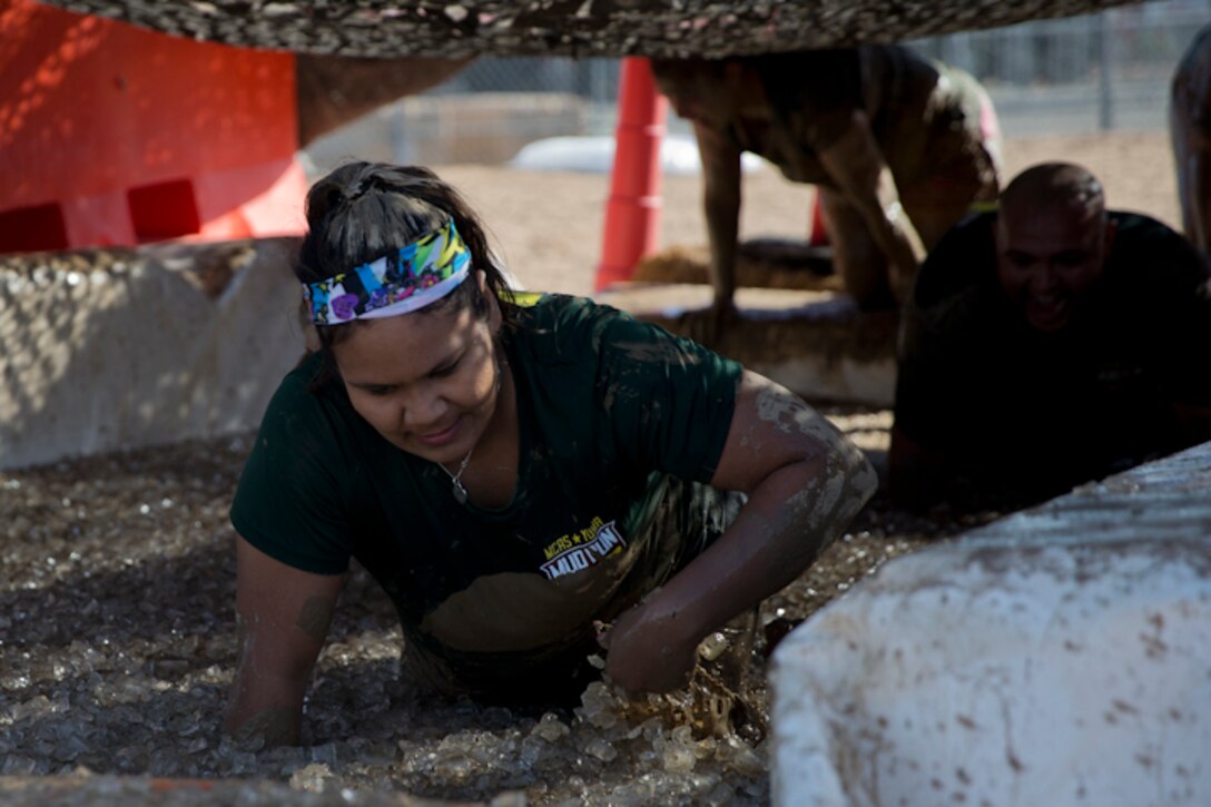 U.S. Marines, Sailors, and Civilians participate in the Marine Corps Air Station (MCAS) Yuma Mud Run at MCAS Yuma Ariz., May 18, 2019. The Mud Run consisted of various obstacles for all of the participants in both the competitive and non-competitive events. (U.S. Marine Corps photo by Lance Cpl. Joel Soriano)