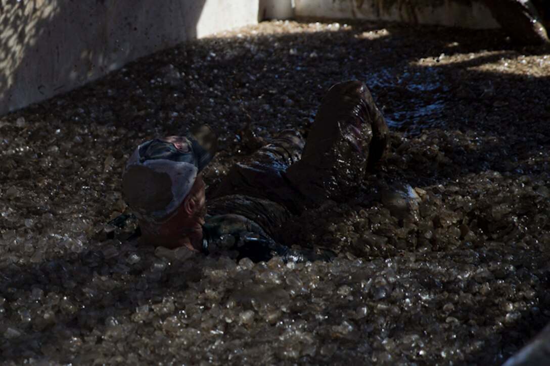 U.S. Marines, Sailors, and Civilians participate in the Marine Corps Air Station (MCAS) Yuma Mud Run at MCAS Yuma Ariz., May 18, 2019. The Mud Run consisted of various obstacles for all of the participants in both the competitive and non-competitive events. (U.S. Marine Corps photo by Lance Cpl. Joel Soriano)