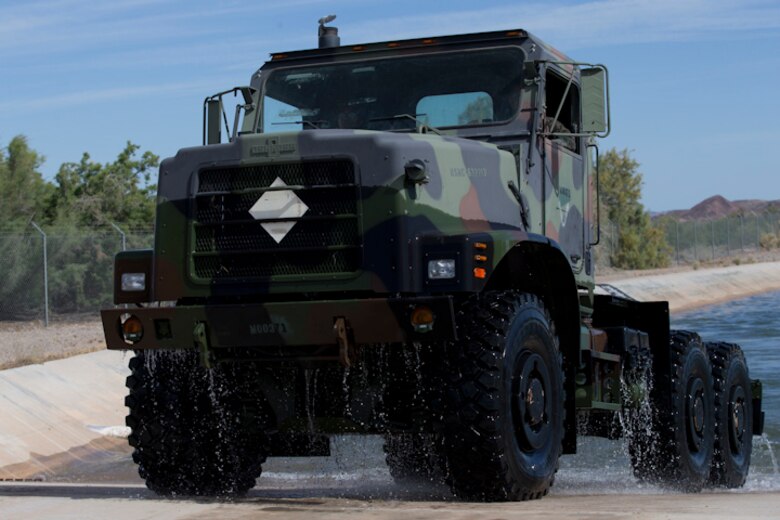 U.S. Marines with Marine Wing Support Squadron (MWSS) 371 participate in a Mud and Fording Course at Cibola Lake Mud course and Fording Basin, Yuma Proving Grounds Ariz., May 21, 2019. The mission of the MWSS-371 Mud and Fording Course is to enhance motor vehicle proficiency while in a wet and humid environment. (U.S. Marine Corps photo by Lance Cpl. Joel Soriano)