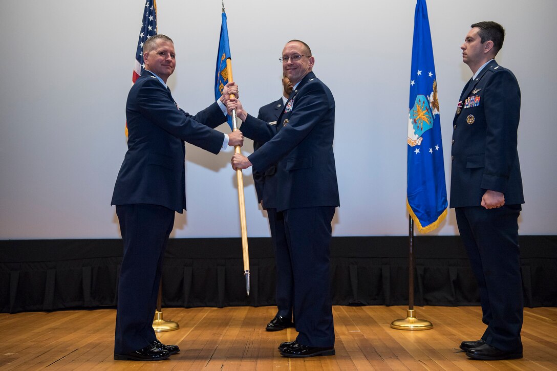 During a Change-of-Command Ceremony at the Joint Base McGuire-Dix-Lakehurst base theater, 14 June, Lt. Col. Gary P. Beckett relinquished command of the Northern Recruiting Squadron to Lt. Col. Timothy Martin. The Squadron commander leads a team of 100 Airmen spread throughout twenty states who recruit For the Air Force Reserve.