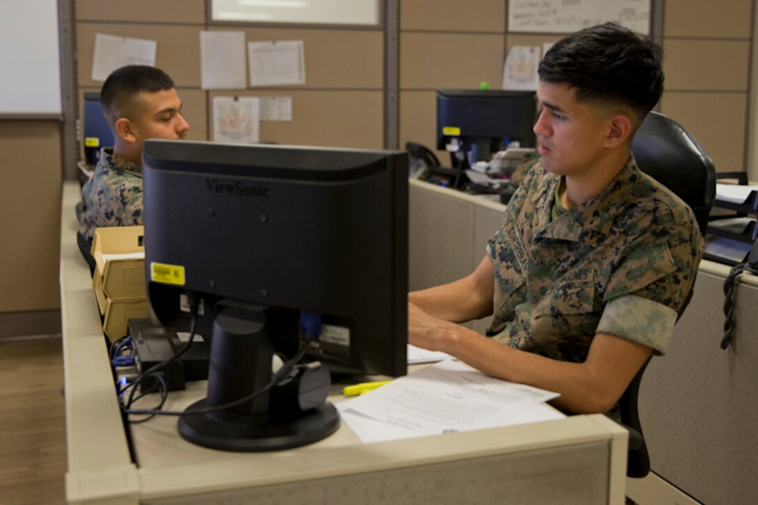 U.S. Marine Corps Lance Cpl. Matthew E. Rivera, an administrative specialist with Installation Personnel Admin Center (IPAC), Headquarters and Headquarters Squadron Marine Corps Air Station (MCAS) Yuma, conducts his administrative duties at the IPAC on MCAS Yuma Ariz., May 28, 2019. The IPACs' mission is to provide professional, quality personnel administration services to all Marines and family members assigned to MCAS Yuma. Ensuring every Marine is administratively ready for worldwide assignment. (U.S. Marine Corps photo by Lance Cpl. Joel Soriano)
