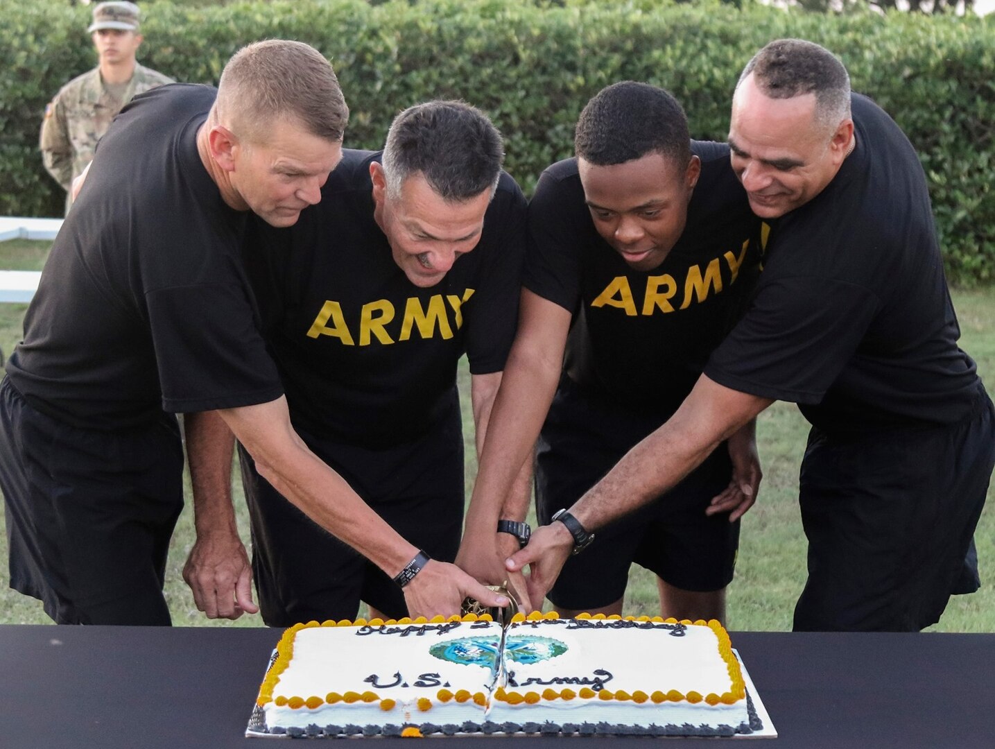 The oldest and youngest Soldiers present, Col. William Bruce (second from left), deputy director for Dental Directorate G-3/5/7, and Spc. Dazhir Walker (second from right), a musician with the 323d Army Band "Fort Sam's Own," joined Lt. Gen. Jeffrey S. Buchanan (far left), commanding general, U.S. Army North (Fifth Army), and ARNORTH Command Sgt. Maj. Alberto Delgado (far right)in the cake cutting ceremony after the Army Birthday Run June 13. Approximately 2,000 Soldiers celebrated the 244th Army Birthday with a 3 1/2-mile run and were joined by Airmen from throughout JBSA, as well as civilians, friends and family members. The run is one of several events the Army units participated in to celebrate the Army's birthday June 14.
